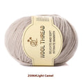 One roll of fine, twisted woolen hand-knitting yarn in a colour from the available palette, shown next to knitting needles.