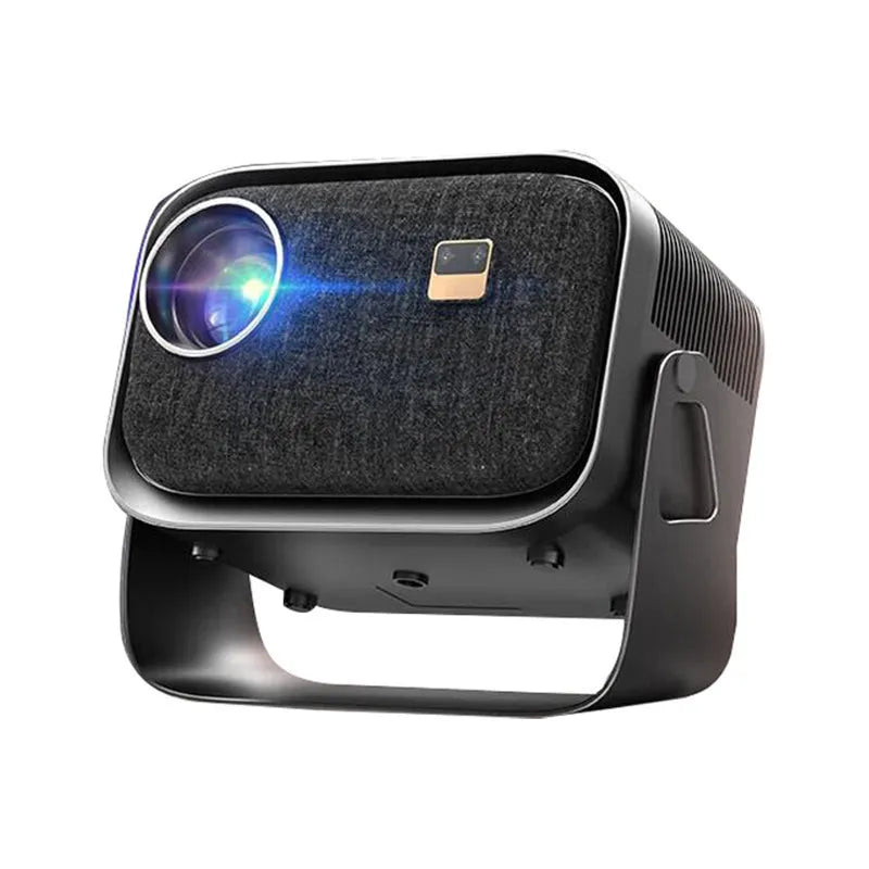 Portable 4K smart home theatre projector unit on a table, showing compact design and lens.