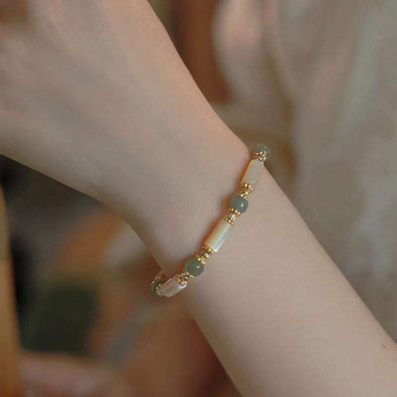 Women's natural white Hetian jade bracelet with lip shell design and round beads