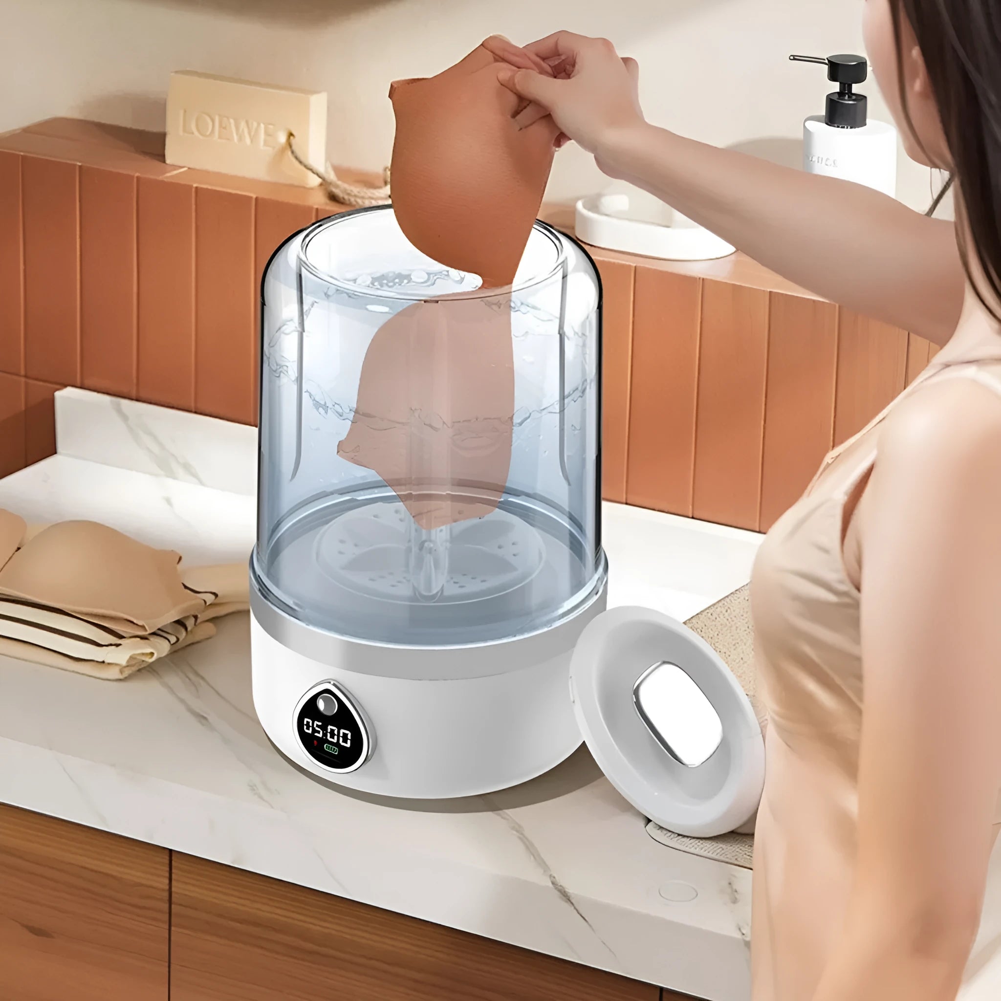 Compact white plastic portable washing machine with USB power cable.