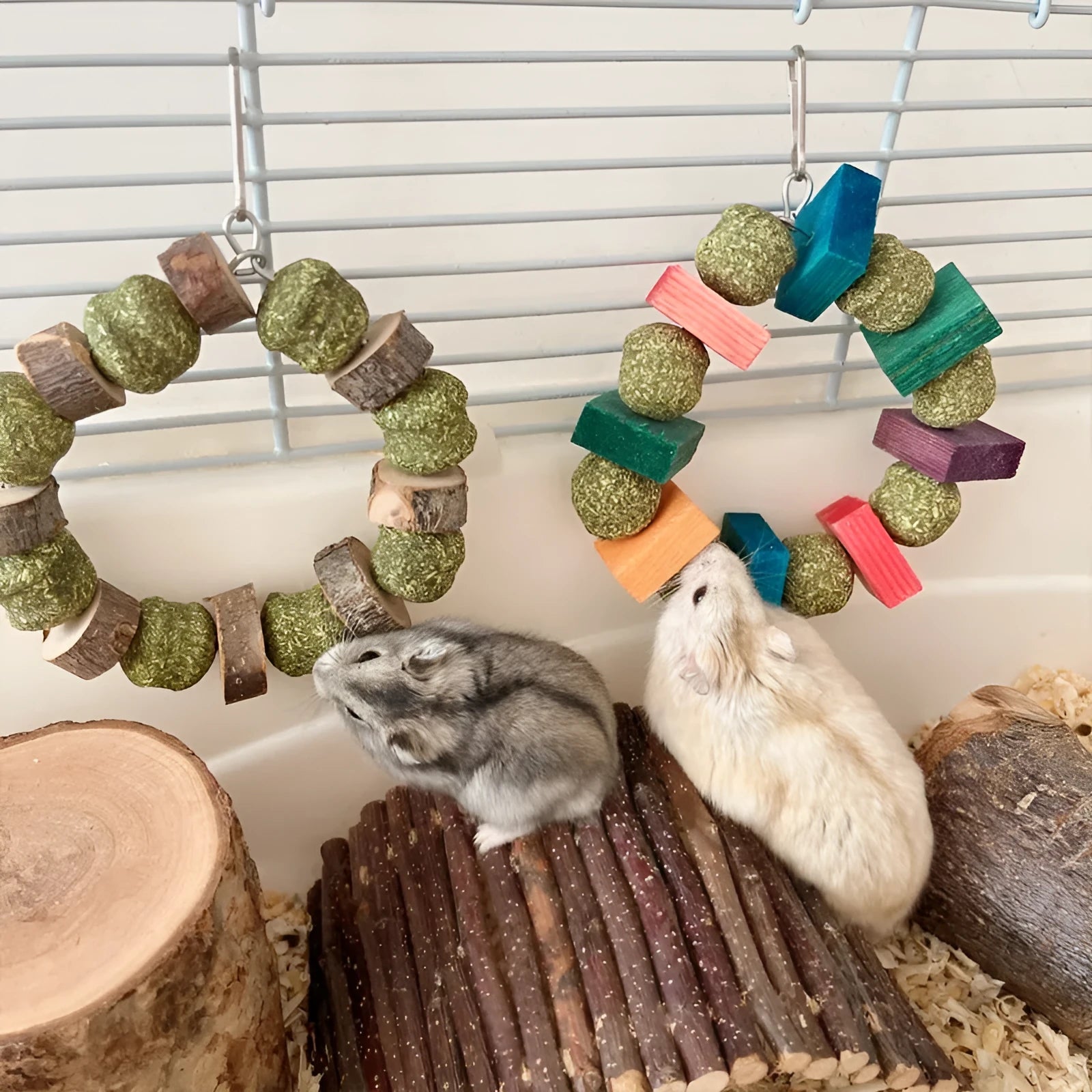 Hamster toy set showing decorative straw ball rings and applewood molar bite rod for small animal enrichment