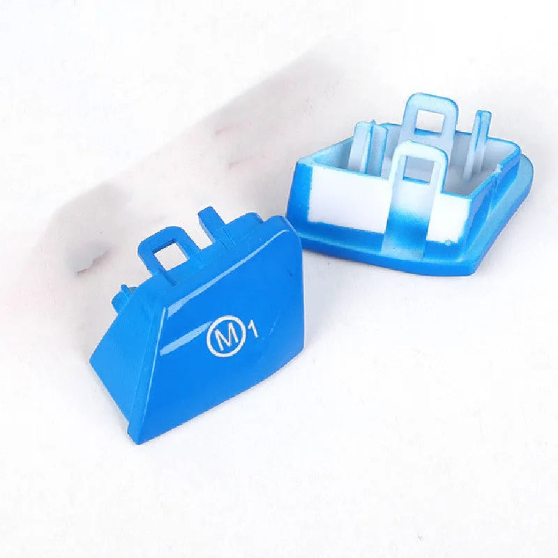 Pair of red and blue M1M2 steering wheel mode buttons for BMW F30 and F34 models with installation keys.
