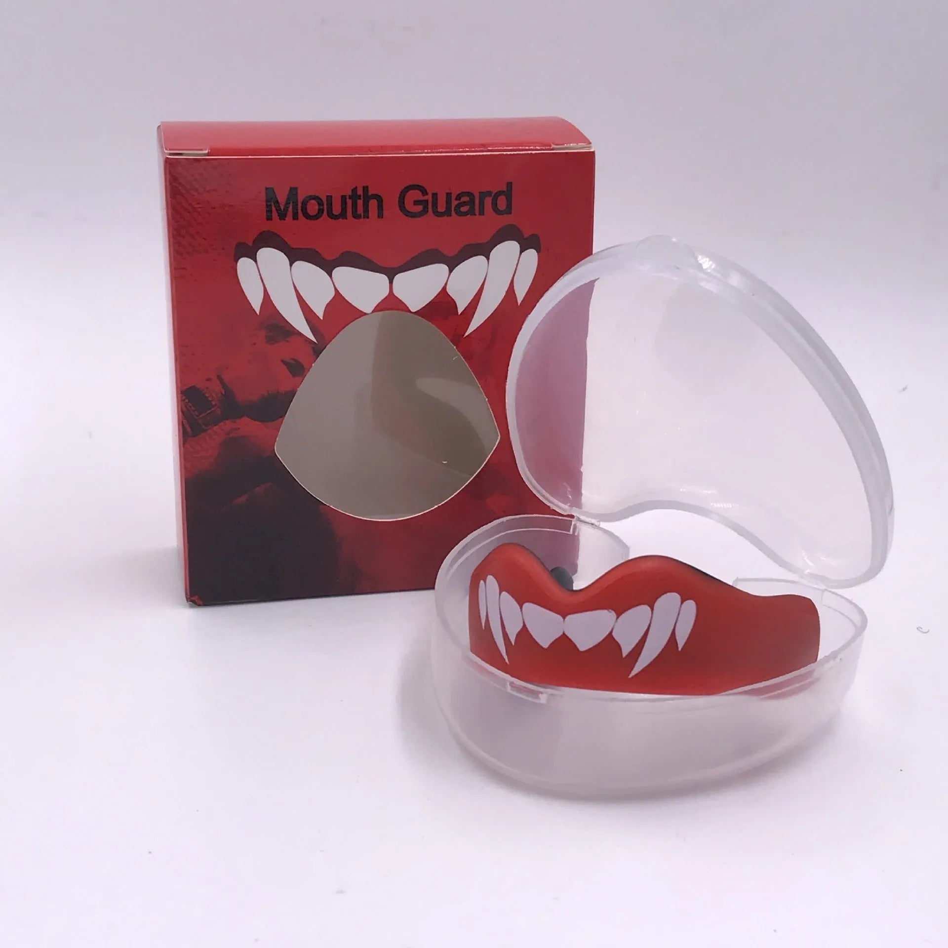 Adult boxing mouthguard with printed teeth design in choice of colours, shown with protective case.