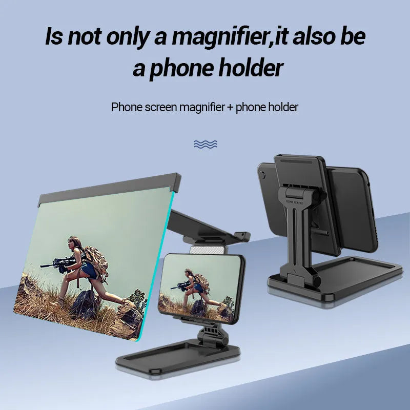 Black foldable mobile phone screen magnifier with detachable phone holder shown on a desktop.
