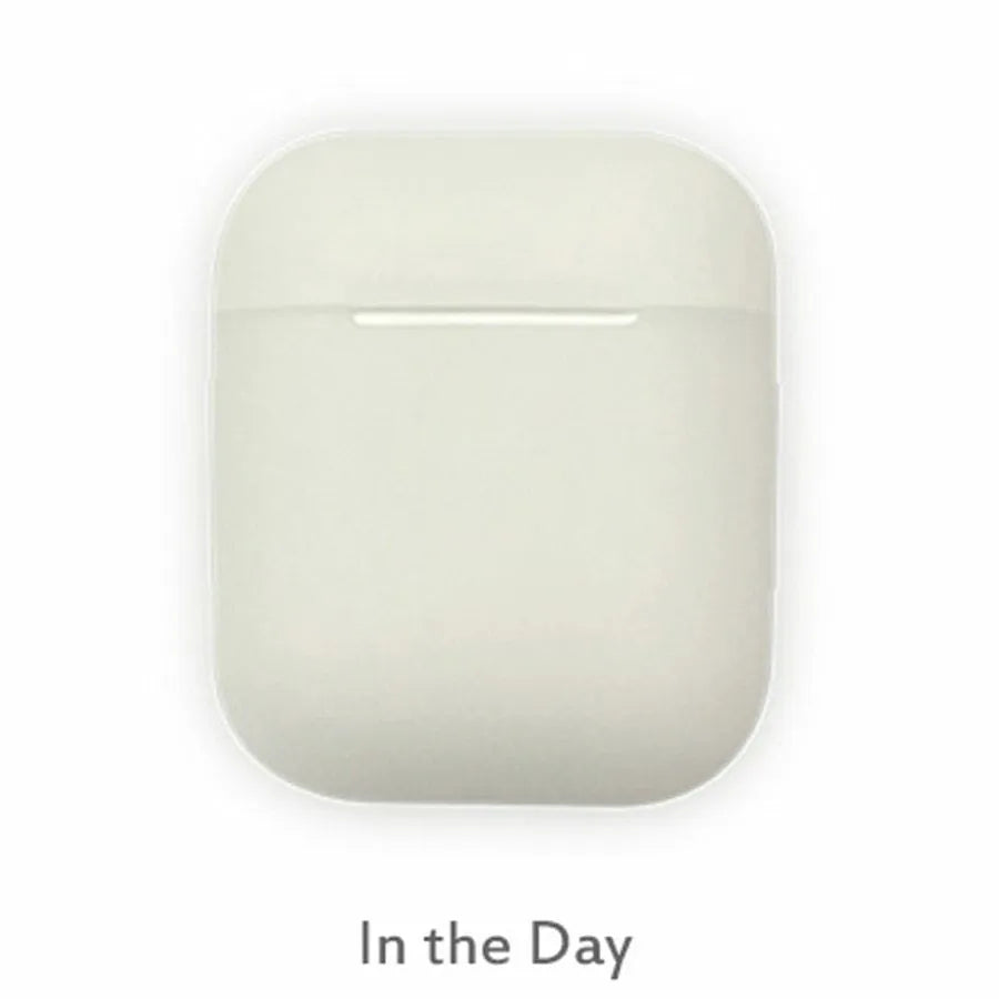 Luminous glow-in-the-dark silicone flip-top protective case for Apple AirPods on a dark background