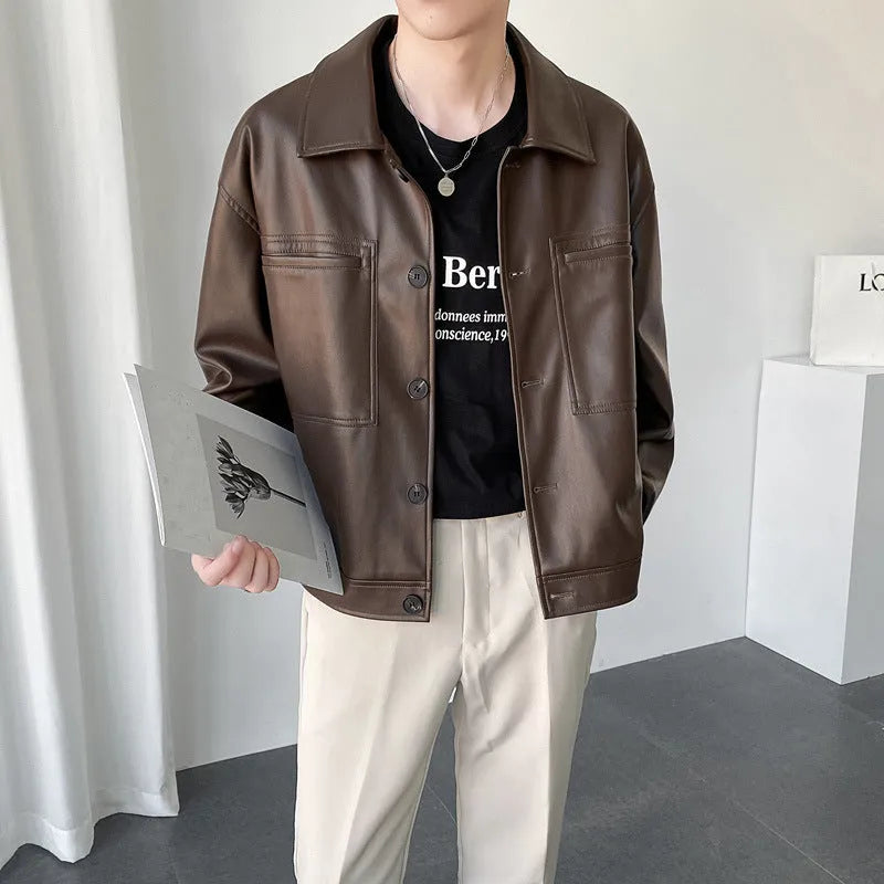 Men's short PU leather jacket with retro lapels, ruffle detailing, and side seam pockets in brown colour