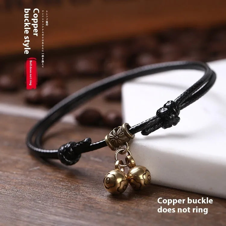 Adjustable nylon rope dog collar with brass bell shown in black, red, and coffee colours for small dogs.