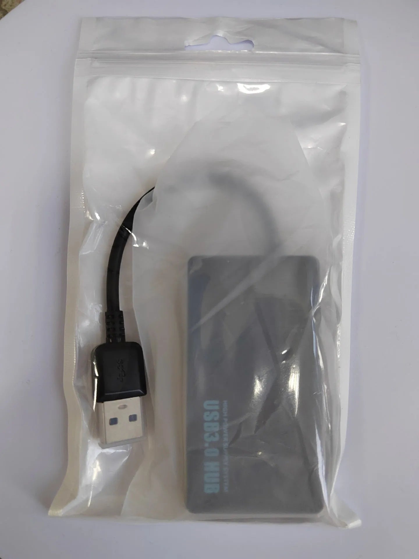 Type-C USB hub extender with 4 ports and 20cm cable in blister packaging