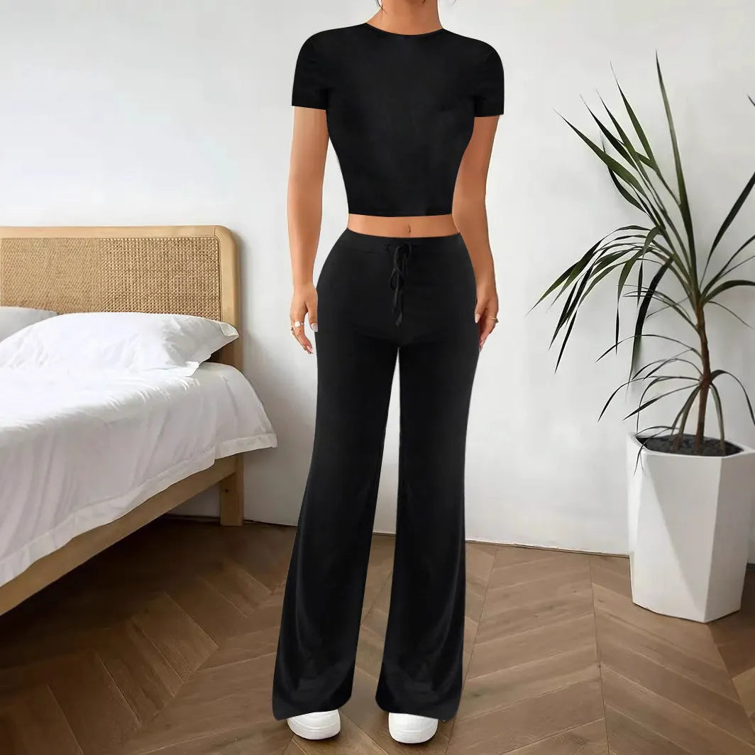 Black high-waisted trousers and short sleeve T-shirt co-ordinated suit for women.