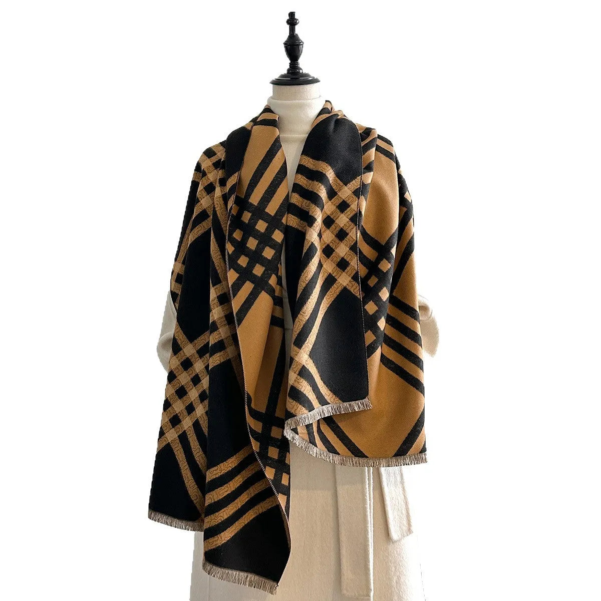 Mid-length brown imitation cashmere winter scarf with tassel trim laid flat.