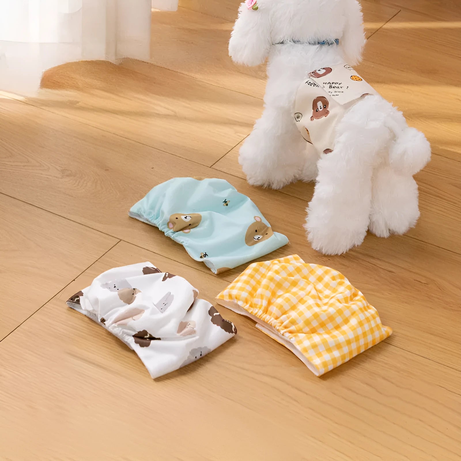 Reusable cartoon bone print dog diaper with fastener tape and elastic waistband, shown in blue bear pattern.