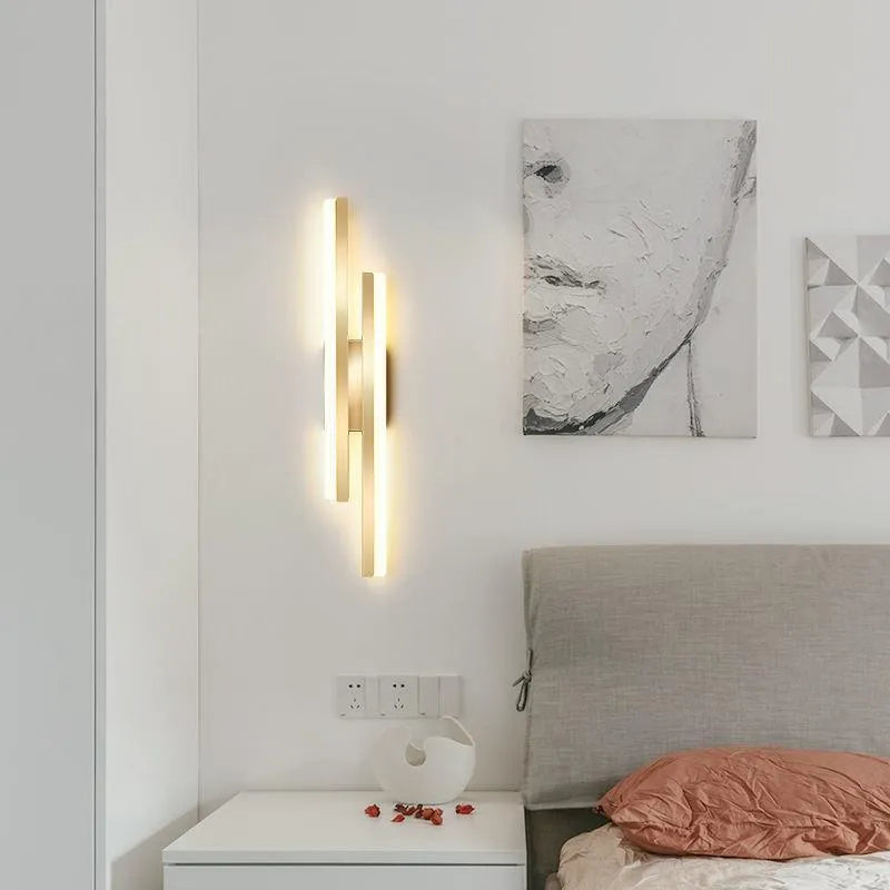 Minimalist Scandinavian-style LED wall light with acrylic shade in black or gold finish