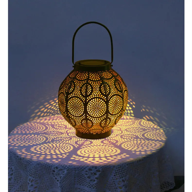 Solar-powered decorative iron courtyard lantern with warm white LED light.