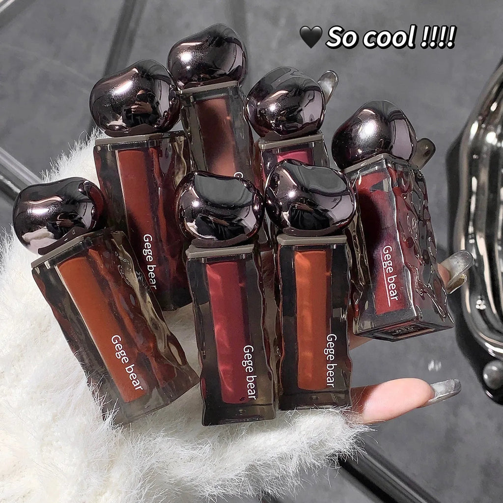 Glacier Lava Lip Lacquer in water-light texture with mirror finish across seven colour numbers