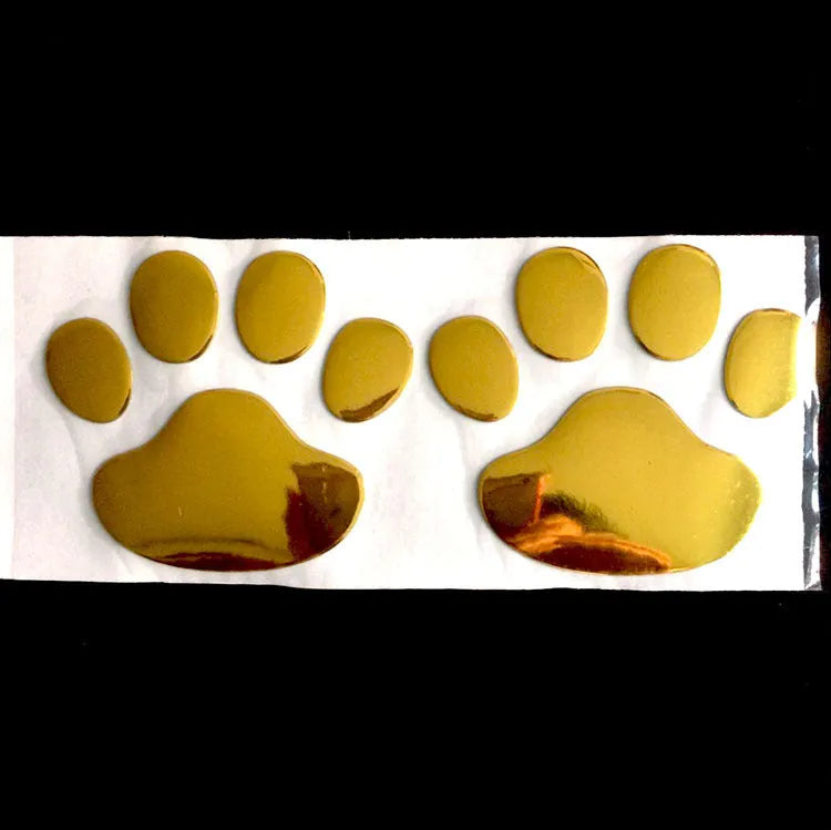 PVC car sticker with hand-shaped brush dog footprints design on a car bumper.