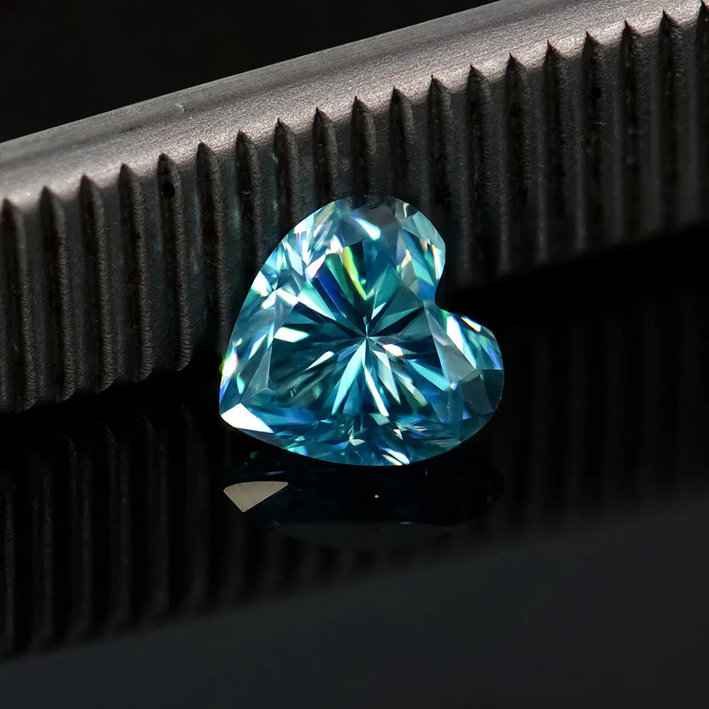 Heart-shaped moissanite gemstone in lemon yellow colour, shown alongside other colour options.
