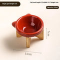 Porcelain cat drinking water bowl in bright red single grid configuration on surface