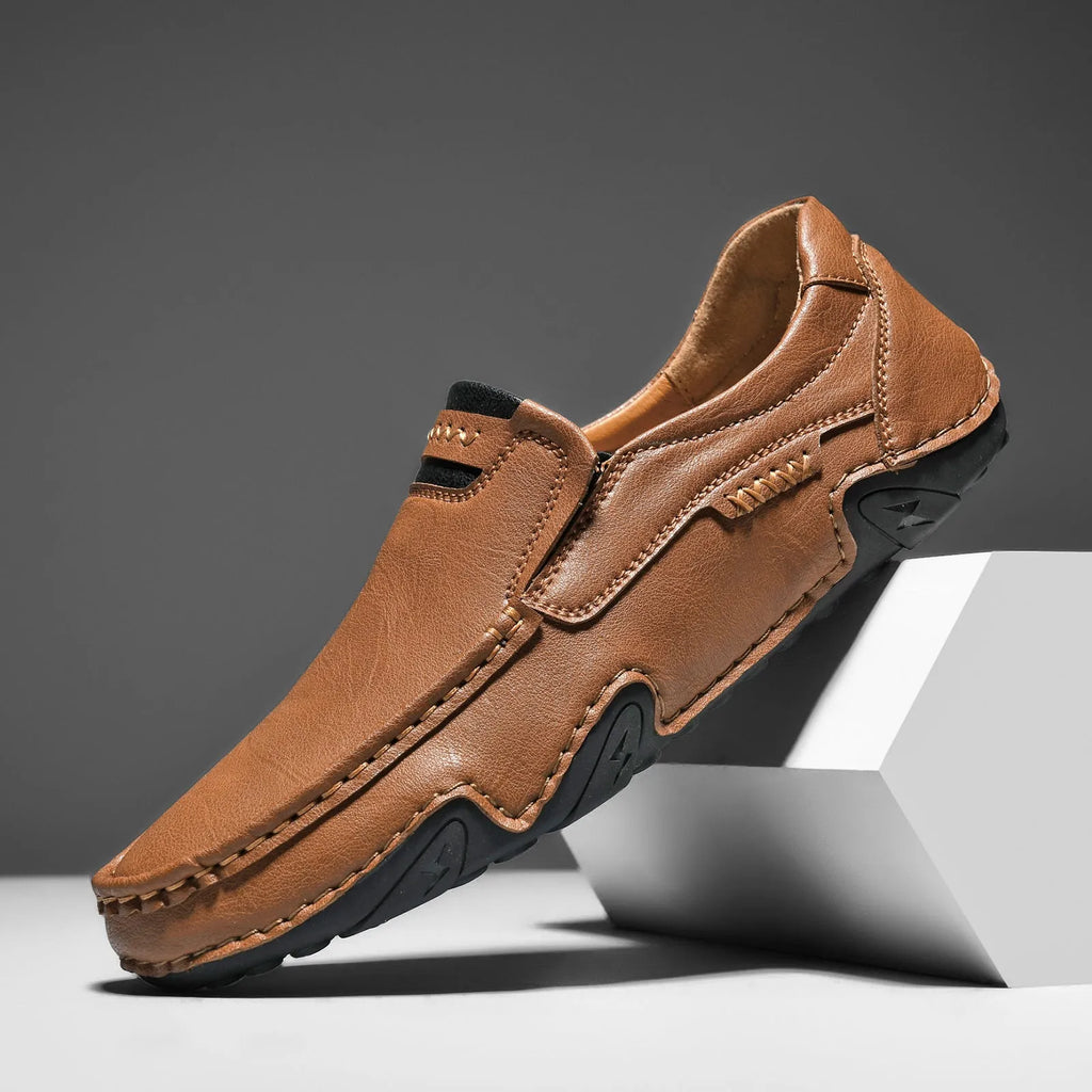 Casual slip-on shoes in multiple colours with a microfiber upper and flat rubber sole.