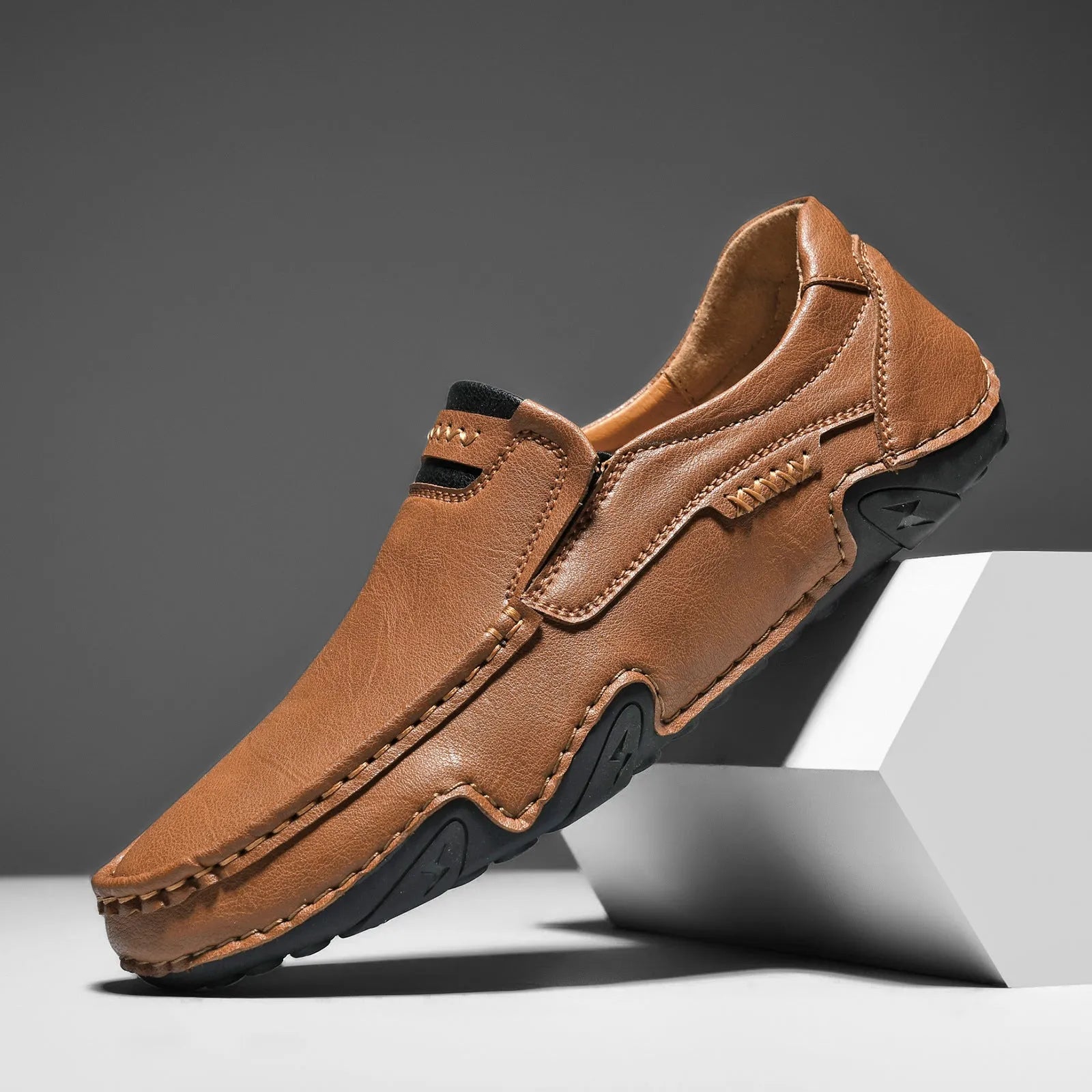 Casual slip-on shoes in multiple colours with a microfiber upper and flat rubber sole.