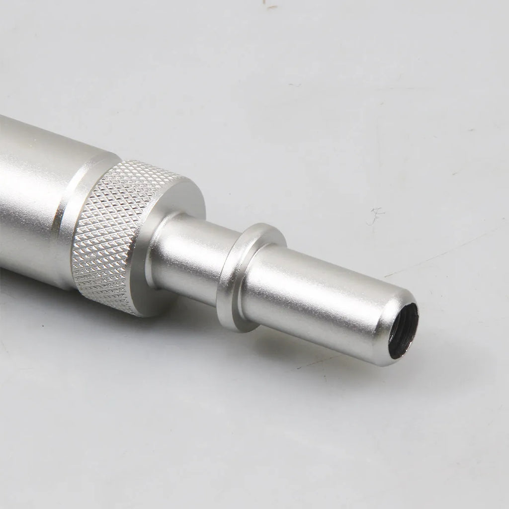 Silver metal VAS6262-9 transmission refuelling joint tool on a workshop bench.