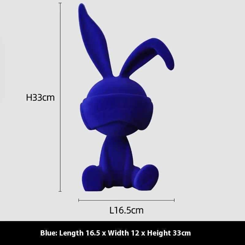 Suede blindfold rabbit resin table ornament in blue, green, or red colour options.