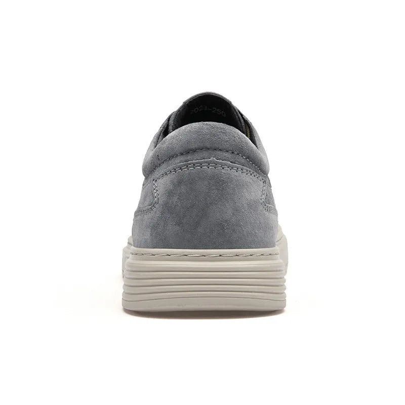Men's gray casual skate shoes with pigskin upper and rubber sole on a white background.