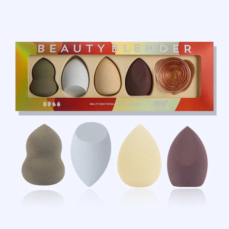 Four coloured hydrophilic polyurethane beauty eggs placed on a metal stand for makeup application