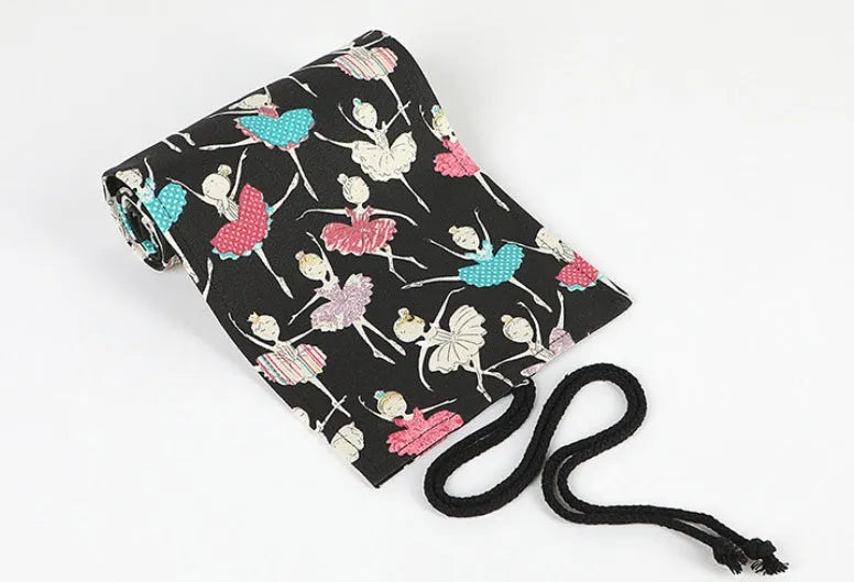 Square canvas rolling pencil case with ballet girl print, showing multiple holes for pencils
