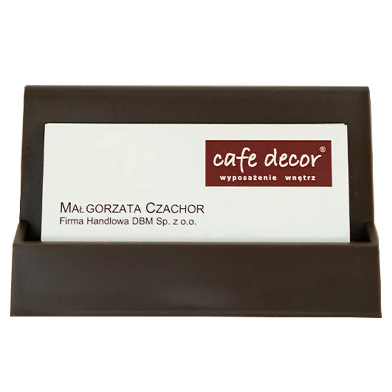 Creative PS geometric business card stand in brown, holding 20 cards upright on a desk.