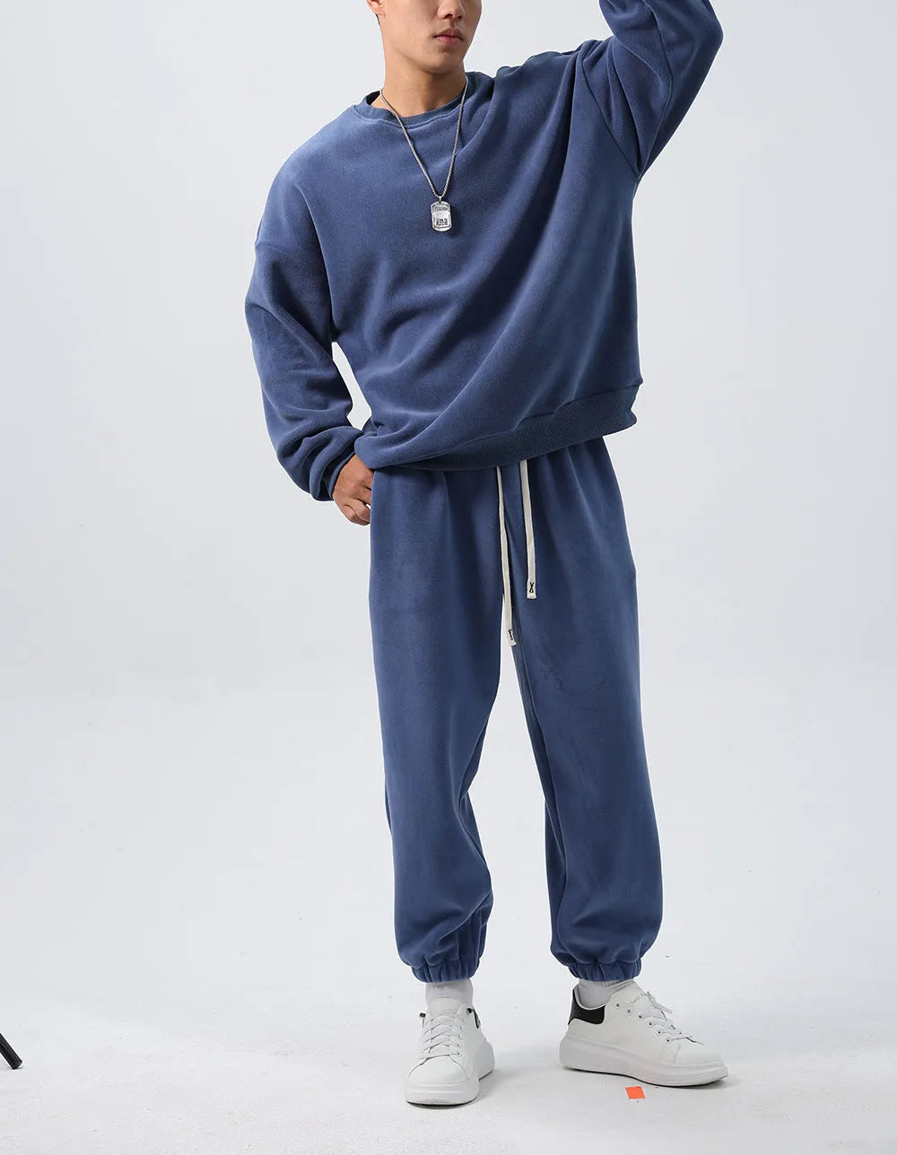Men's polar fleece sports suit set showing crew neck top with long sleeves and matching padded trousers in winter colours