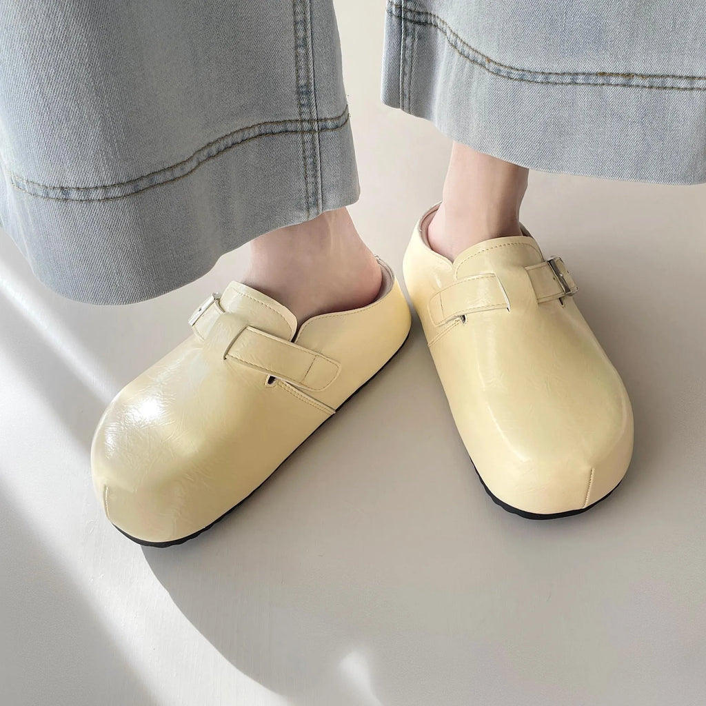 Flat buckle casual sneakers in yellow colour with round toe and PU upper material