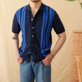 A striped knitted cardigan polo shirt with short sleeves and a lapel collar, shown in a light blue colour.