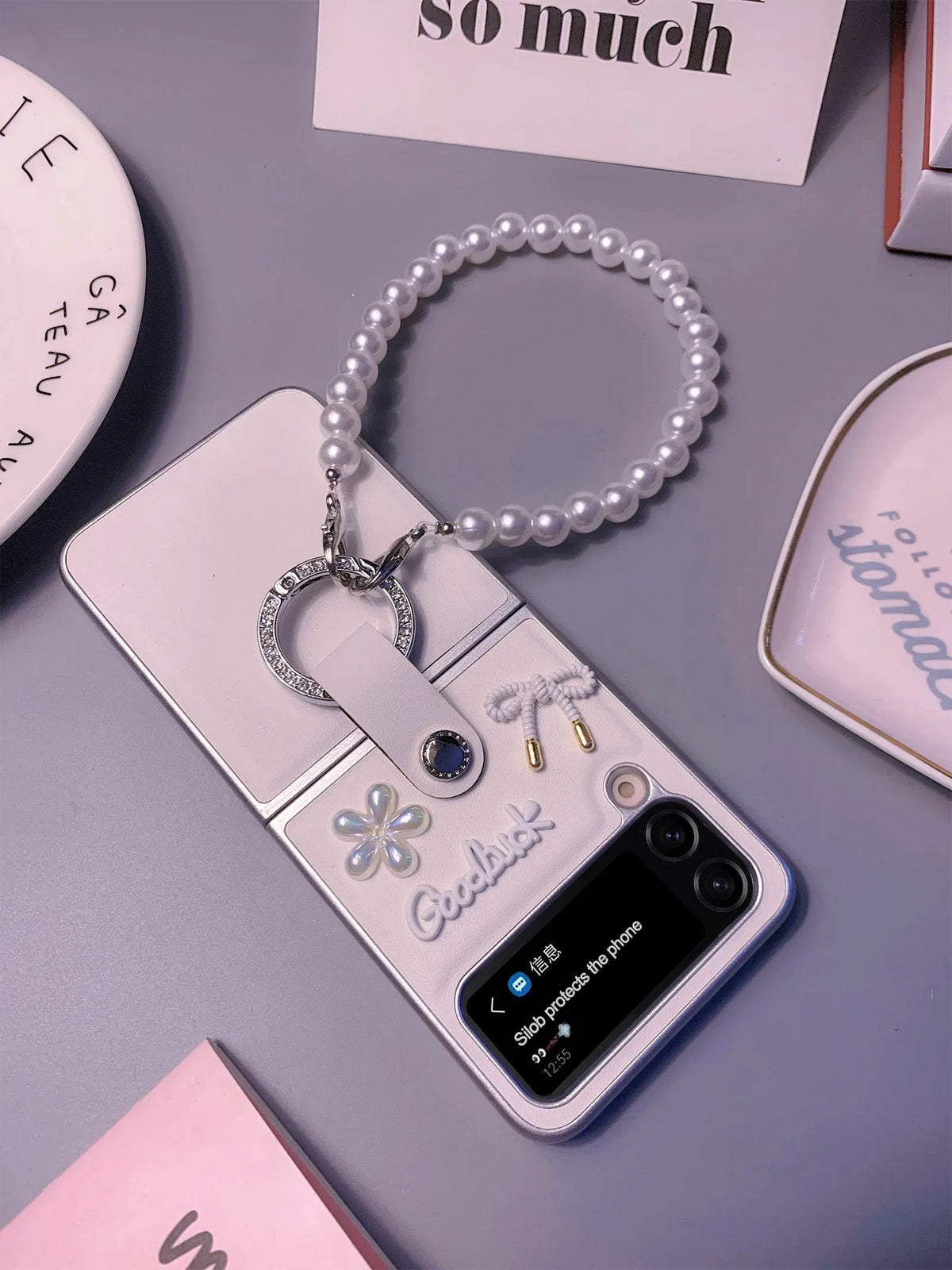 Ultra thin faux leather folding phone case for Samsung Galaxy Z Flip with white silver border, flower bow and bracelet