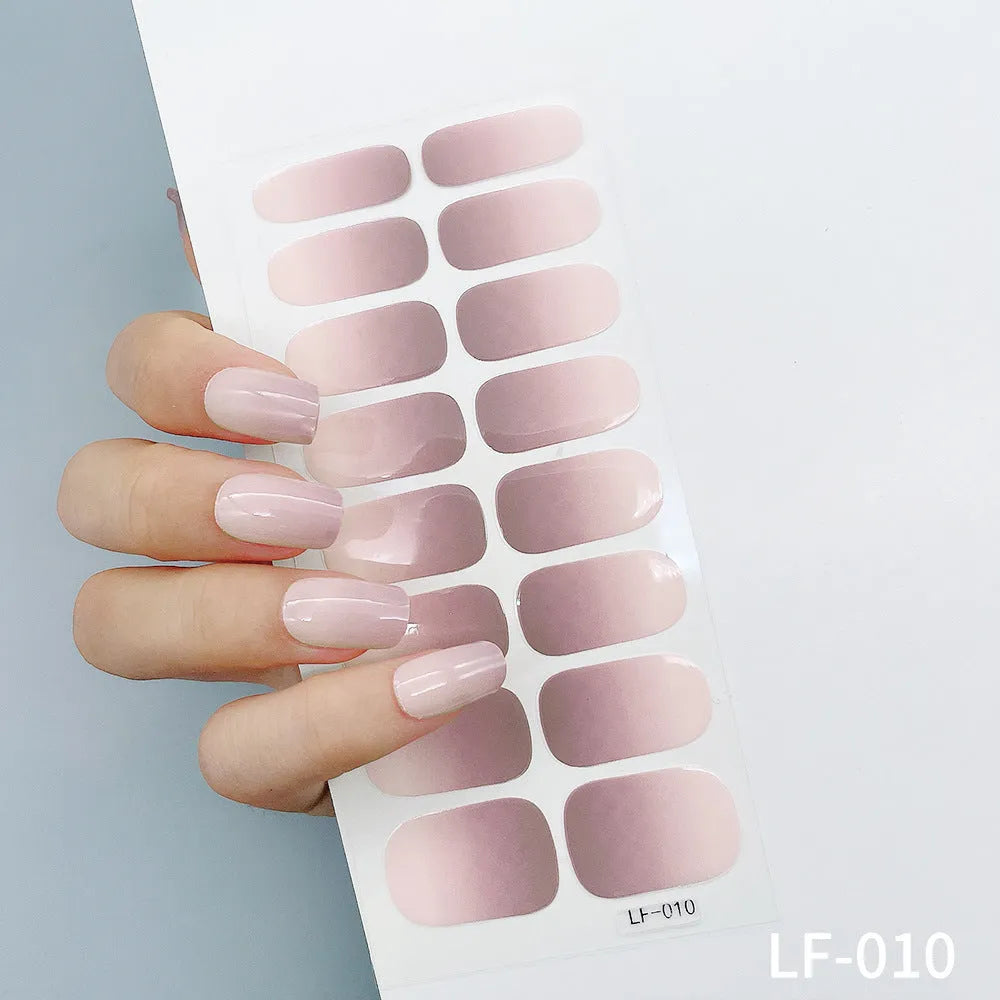 16 solid colour full nail art stickers with 22 patterns including cross, rose, butterfly designs in 12x6mm oval size