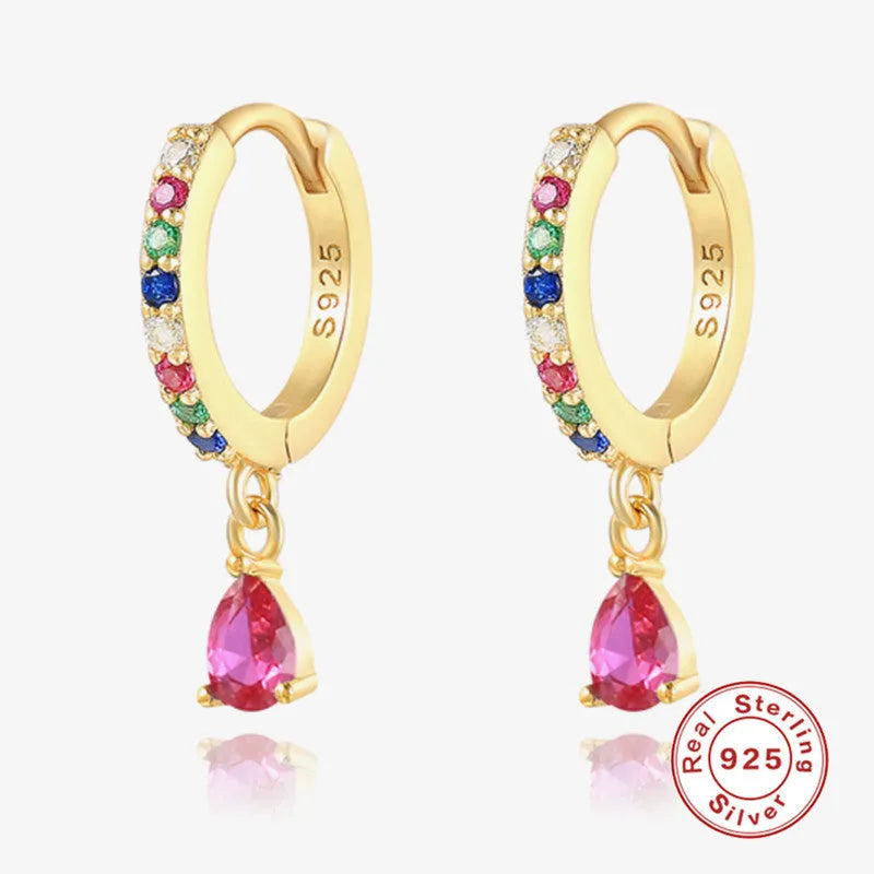 S925 sterling silver water drop shaped earrings with a gemstone accent on a gold or silver background.