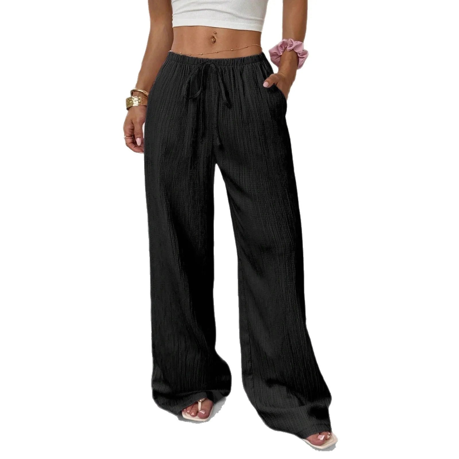 Black wide-leg women's trousers with a front lace-up waist detail on a neutral background.