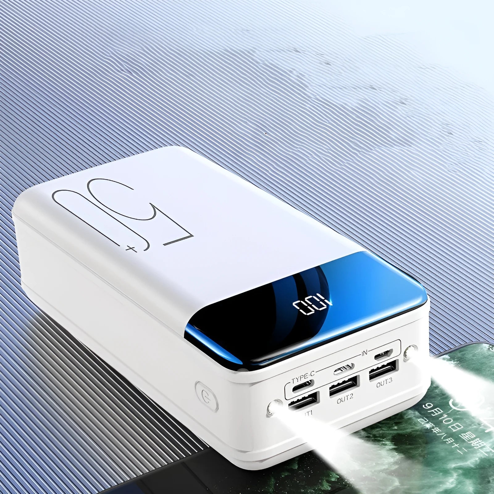 Black and white large 50000mAh portable power bank with three USB ports on the side