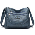 Soft black PU leather women's crossbody shoulder bag with a square shape on a white background.