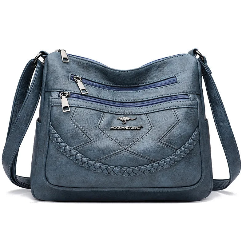 Soft black PU leather women's crossbody shoulder bag with a square shape on a white background.