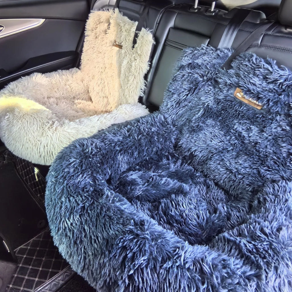 Beige thick padded dog car seat cover with non-slip base on a grey car seat.