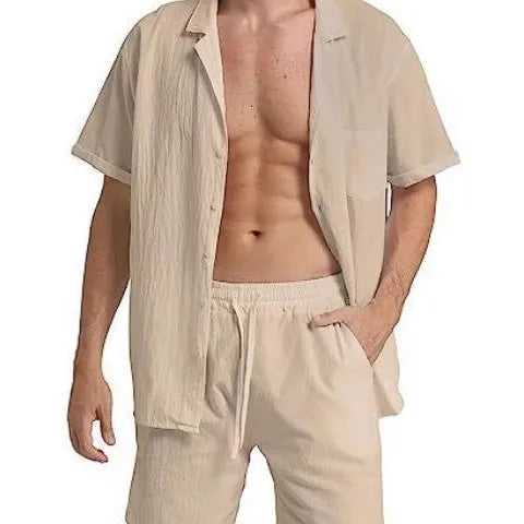 Man wearing a grey flax linen short-sleeved top and matching shorts from the summer sports suit set.