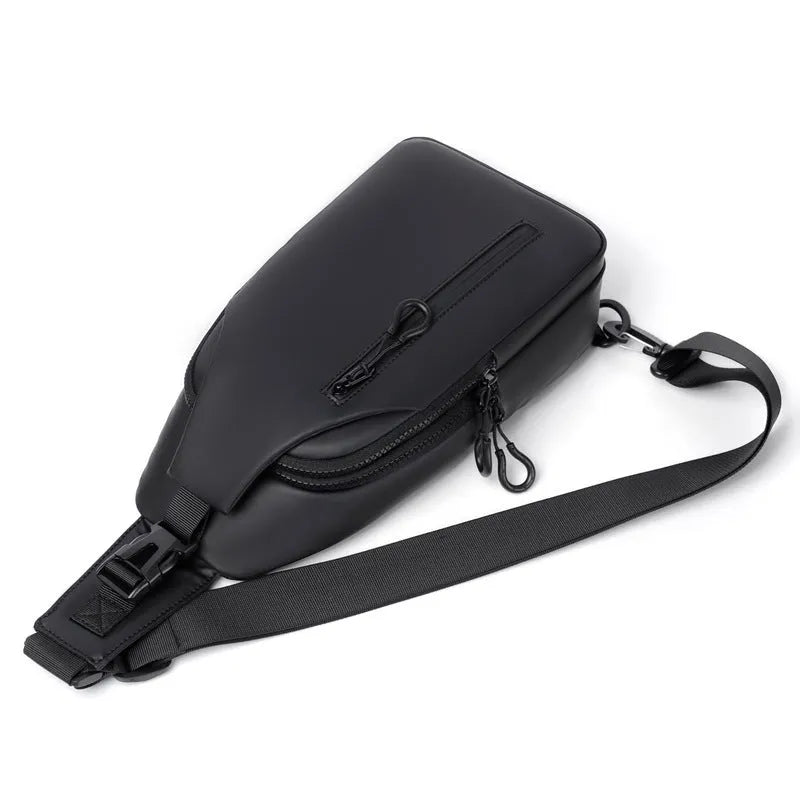 Black sling crossbody backpack for men with zipper and polyester lining, vertical square shape, solid colour design
