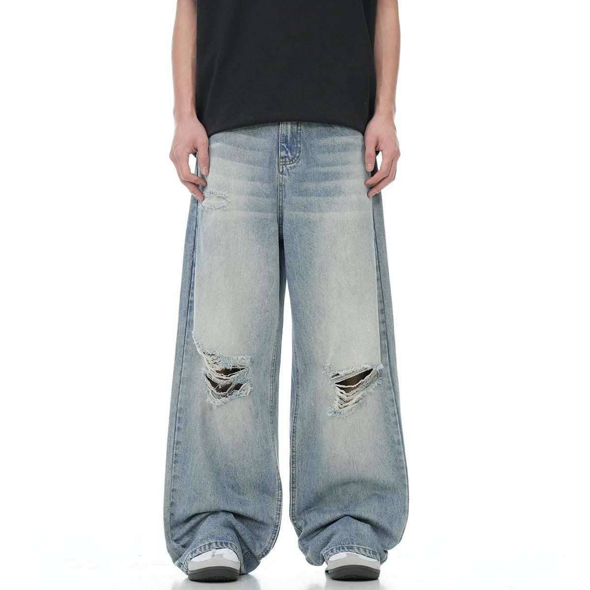Men's blue straight-leg jeans with distressed ripped details and a zipper fly.