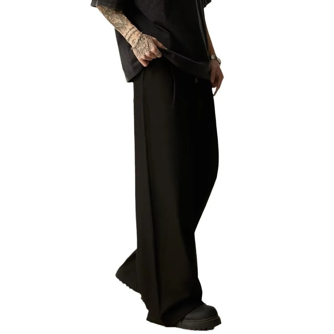 Men's solid colour casual trousers with wide-leg design and elasticated waist in cotton-polyester blend fabric