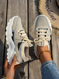 Women's Flyknit mesh lace-up sneakers in various colours with a round toe and rubber sole.
