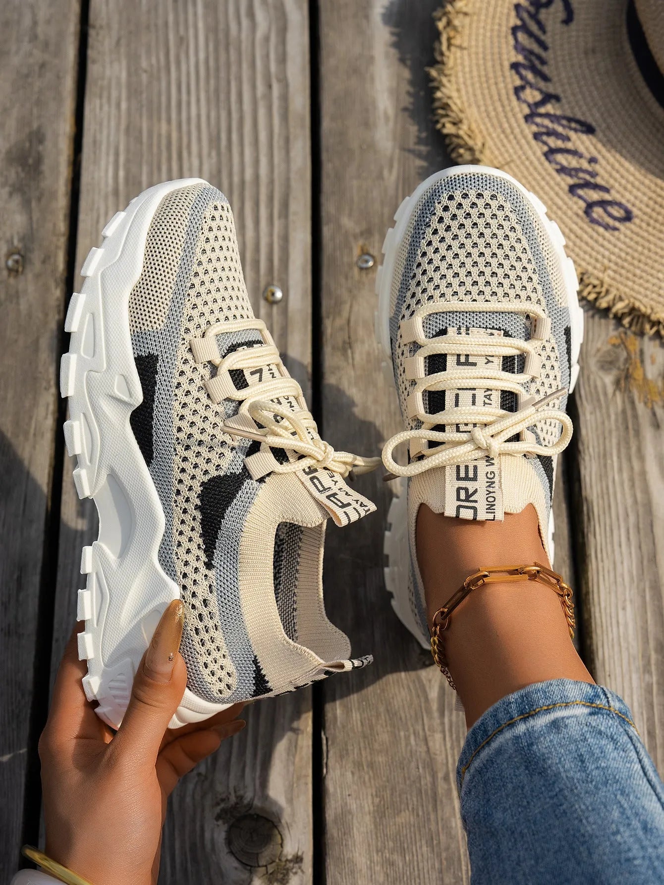 Women's Flyknit mesh lace-up sneakers in various colours with a round toe and rubber sole.