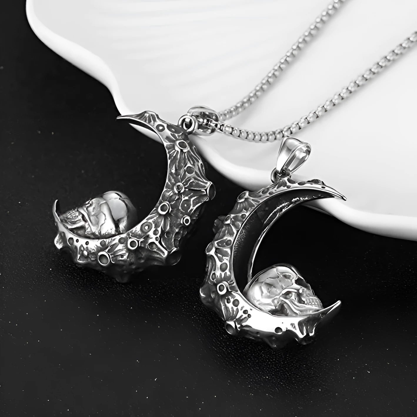 Men's stainless steel skull necklace with silver electroplated finish showing six pendant design options