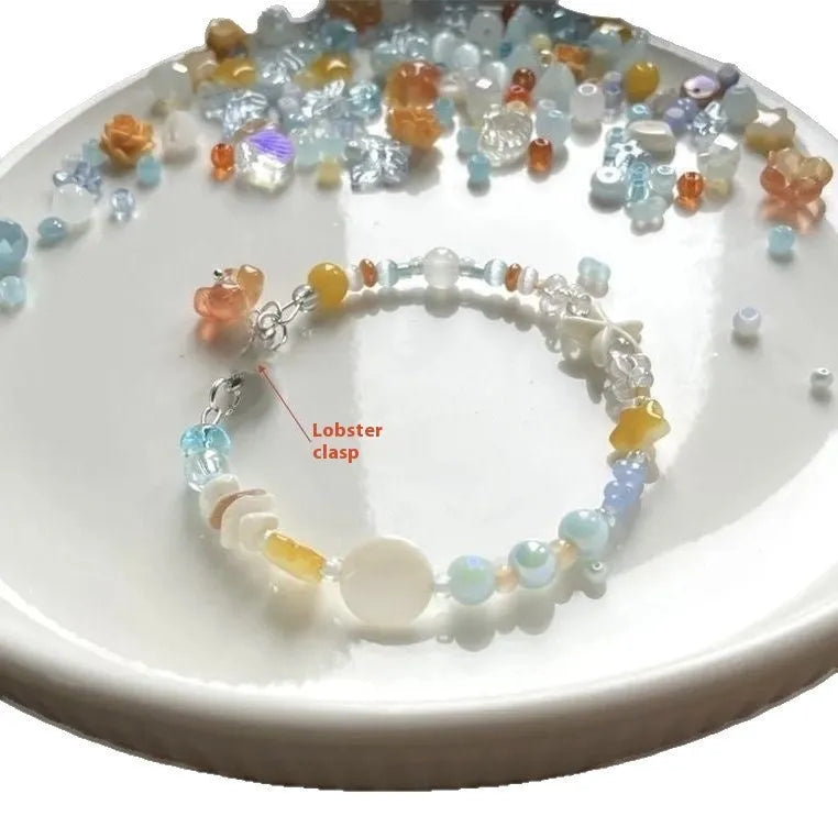 Orange sea colour summer bracelet with diamond shape and round mixed-material elements on wrist