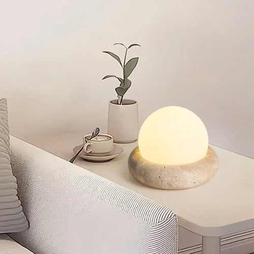 Cream modern bedside night light with remote control on wooden table