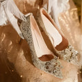 Champagne coloured pointed toe bridal shoes with rhinestone flower pattern and fine heel.